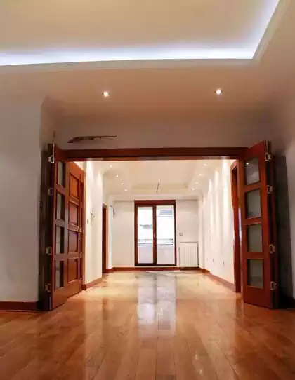 Interior of residential apartment building with wooden window frames