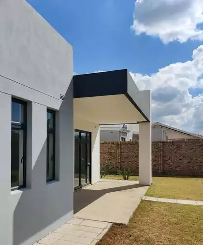 Lone column carrying roof over back veranda in Harare house