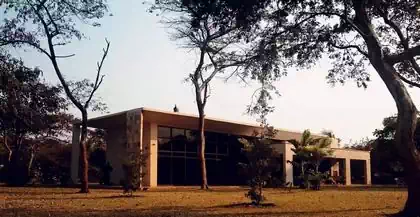 Sleek minimalist modern house design with large horizontal roofs and big overhangs covering veranda. Building design by Pantic Architects